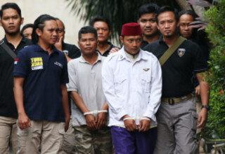 East Jakarta Police arrested two people for their alleged involvement in the intimidation and assault of a 15-year-old student over a social media post he made, which they considered to be insulting of firebrand cleric Rizieq Shihab. (Antara Photo/Rivan Awal Lingga)