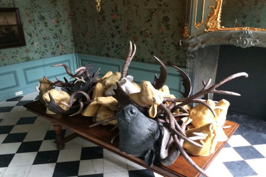 Photo 2: Replica of animal hunting trophies made from wax on displayed at Oude Kerk Church in Amsterdam. The wax sculptures are made by Indonesian artist Iswanto Hartono for his exhibition of the Dutch colonial history in Indonesia. This exhibition is a part of the biannual Europalia Arts Festival which will officially starts on October, 10. (Photo courtesy of Iswanto Hartono, an independent photographer)