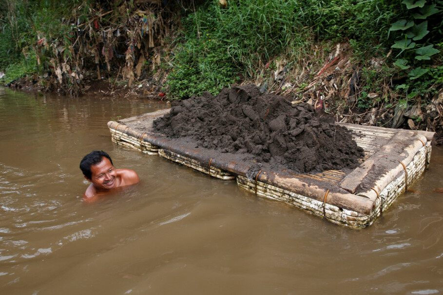 A worker collects sand from the bottom of the Citarum River to make bricks, near Majalaya. (Reuters Photo/Darren Whiteside)