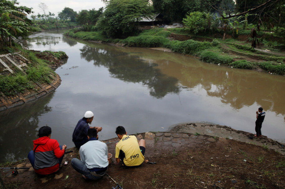 Men fish in a polluted tributary of the Citarum River, near Majalaya. (Reuters Photo/Darren Whiteside)