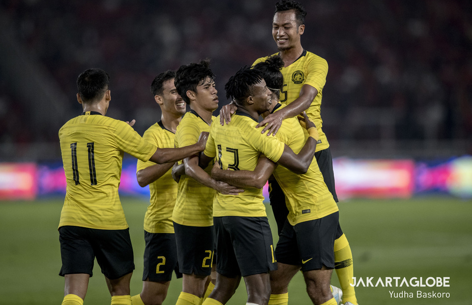 The Malaysians celebrate Mohamadou Sumareh's goal in the 37th minute. (JG Photo/Yudha Baskoro) 