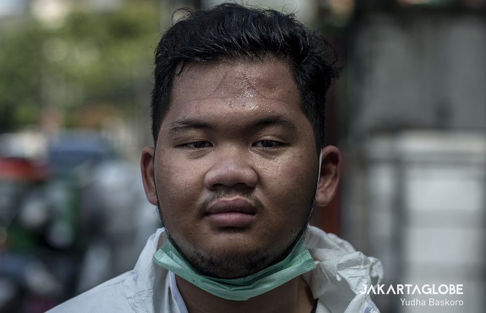 Dendi Muzami, 20, is a Indonesian Red Cross volunteer from Central Jakarta. He dedicates his time to spray the city with disinfectant during coronavirus crisis. (JG Photo/Yudha Baskoro)