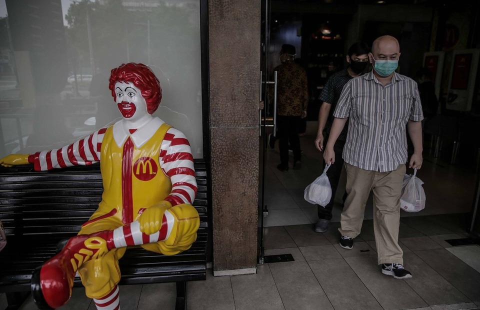 A man walks out of a McDonald