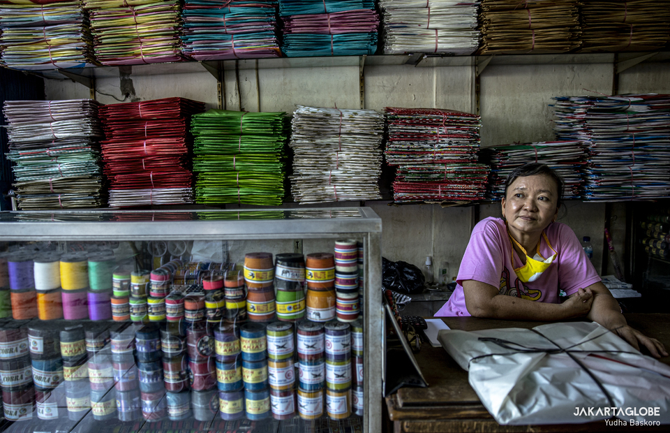 Lidia, 50, sits in Hek shop, a kite shop in Halim, East Jakarta on Thursday (27/08). (JG Photo/Yudha Baskoro)