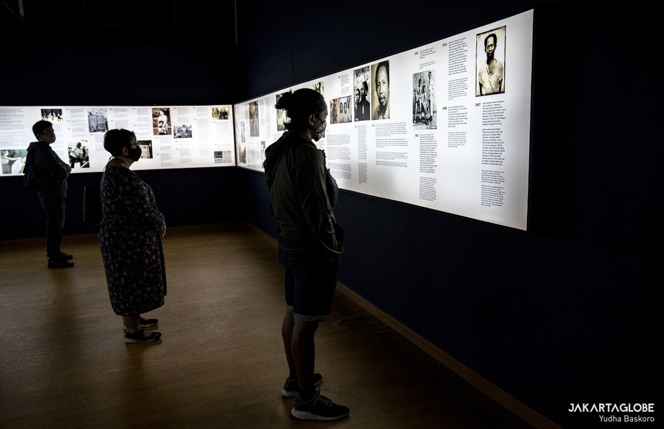 Visitors read Affands biography on a wall during 