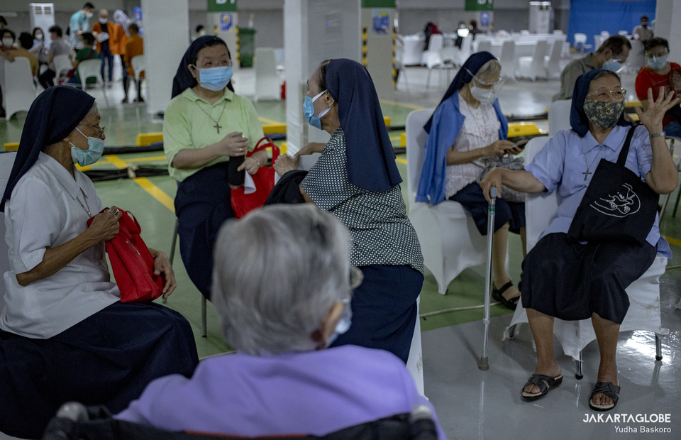 Nuns are seen during the first phase of the nationwide Covid-19 vaccine campaign for religious leaders at Istiqlal Mosque in Central Jakarta on Feb 25, 2021. (JG Photo/Yudha Baskoro)