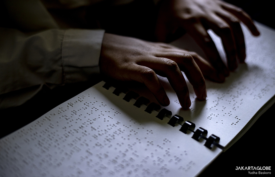 A student reads Koran in Braille at Raudlatul Makfufin, an Islamic boarding school for the blind and visually challenged in Serpong, South Tangerang, Banten on April 21, 2021. (JG Photo/Yudha Baskoro)
