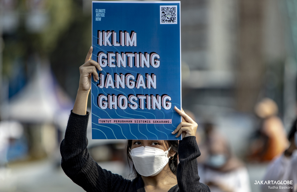 Protester carries placard during protest against climate crisis in Central Jakarta on June 4, 2021. (JG Photo/Yudha Baskoro)