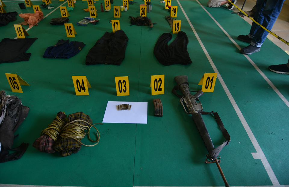 Items seized from slain terrorism fugitive Ali Kalora are displayed at the Parigi Moutong district police office, Central Sulawesi, on Sept. 19, 2021. (Antara Photo/Mohamad Hamzah)