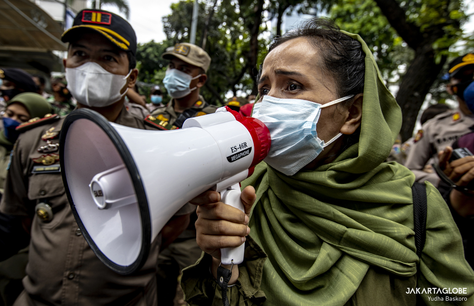 A Afghan woman speaks during protest demand resettlement in front of UNHCR building in Central Jakarta on November 15, 2021. (JG Photo/Yudha Baskoro)