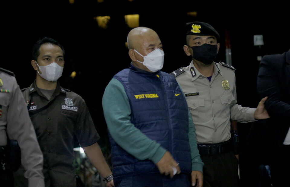 Bekasi Mayor Rahmat Effendi, center, arrives at the Corruption Eradication Commission building in Jakarta on January 5, 2022, for a questioning. He was arrested at his official residence for allegedly taking bribe money. (Beritasatu Photo/Joaito de saojoao)