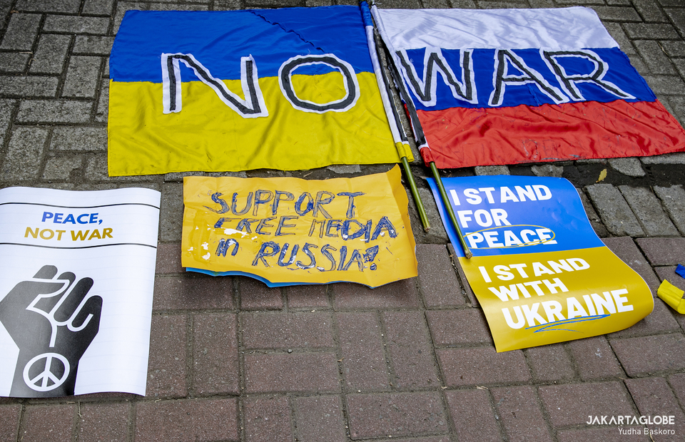 Placards are seen during protest against Russian Invasion of Ukraine in front of Embassy of the Russian Federation building in Central Jakarta on March 4, 2022. (JG Photo/Yudha Baskoro)