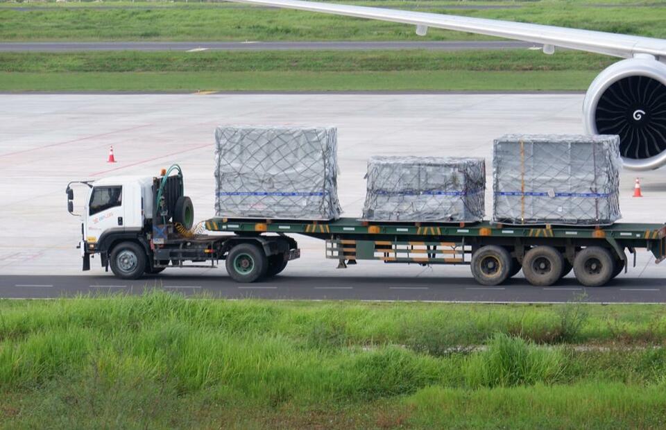 A hauler carries large boxes of MotoGP equipment and engines at Lombok International Airport on March 9, 2022. (Photo courtesy of Mandalika Grand Prix Association)