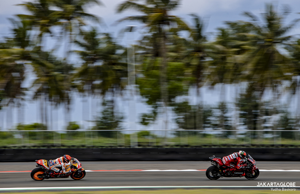 Francesco Bagnaia of Ducati Lenovo and Marc Marquez of Repsol Honda in action during MotoGP Pertamina Grand Prix of Indonesia at Mandalika International Street Circuit, in Lombok, Indonesia on March 19, 2022. (JG Photo/Yudha Baskoro)
