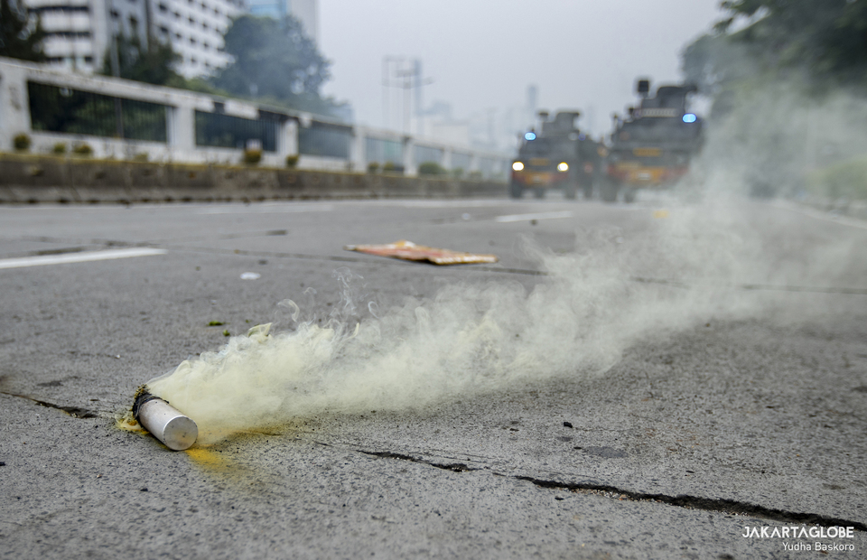 A tear gas is seen during protest in front of House of Representative in Central Jakarta on April 11, 2022. (JG Photo/Yudha Baskoro)