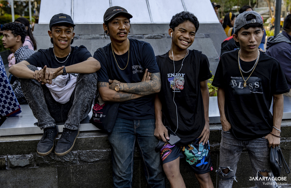 Teenagers hang out in a street fashion show titled Citayam Fashion Week at the Dukuh Atas area in Central Jakarta on July 19, 2022. (JG Photo/Yudha Baskoro)
