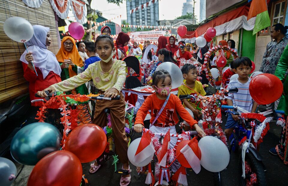 Children parade with decorated bicycles to celebrate Independence Day in Tanah Abang, Central Jakarta, on August 17, 2022. (Joanito De Saojoao)
