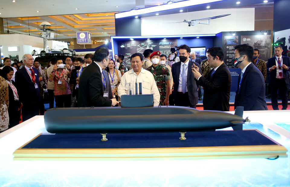 Defense Minister Prabowo Subianto looks at a submarine model during the Indo Defence arms exhibition in Kemayoran, Central Jakarta, on November 4, 2022. (Joanito De Saojoao)