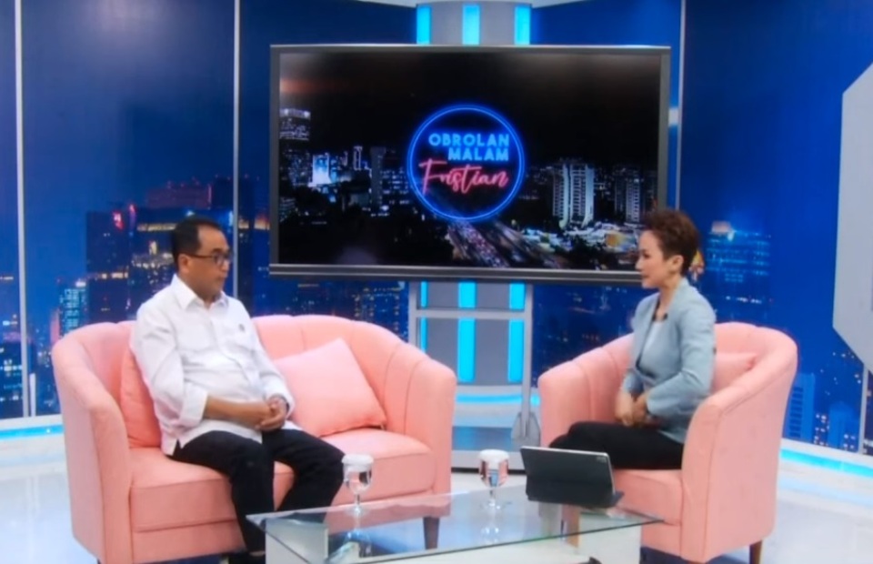 Transportation Minister Budi Karya Sumadi, left, appears in a BTV talk show program hosted by Fristian Girec on November 21, 2022. (BTV)
