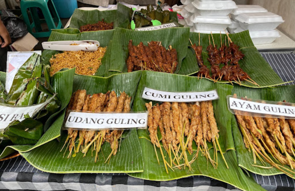 Some of the many foods on offer amongst the market stalls at the festival outside Sudirman Station. PHOTO: LILY MCCURE 